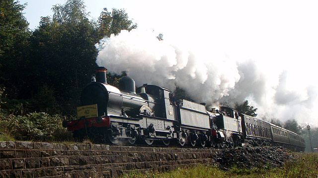 9017 and 4566 passing Tenbury ine 40th annivsary train